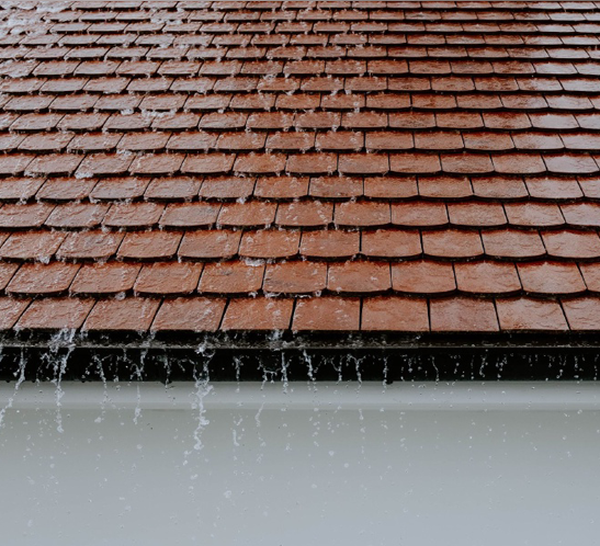 Gutter cleaning service preparing a Phoenix-area home for monsoon season