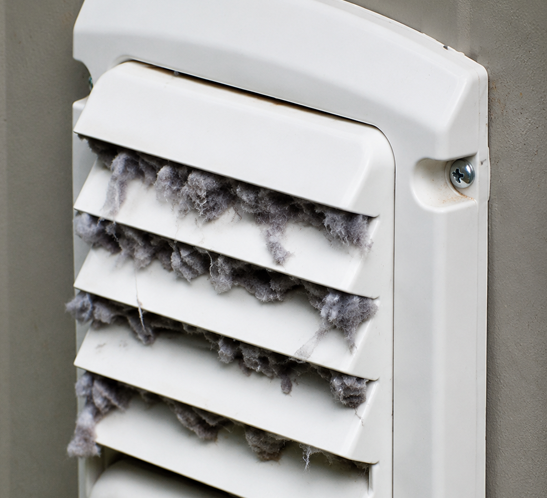 Clogged dryer vent causing overheating and fire risk